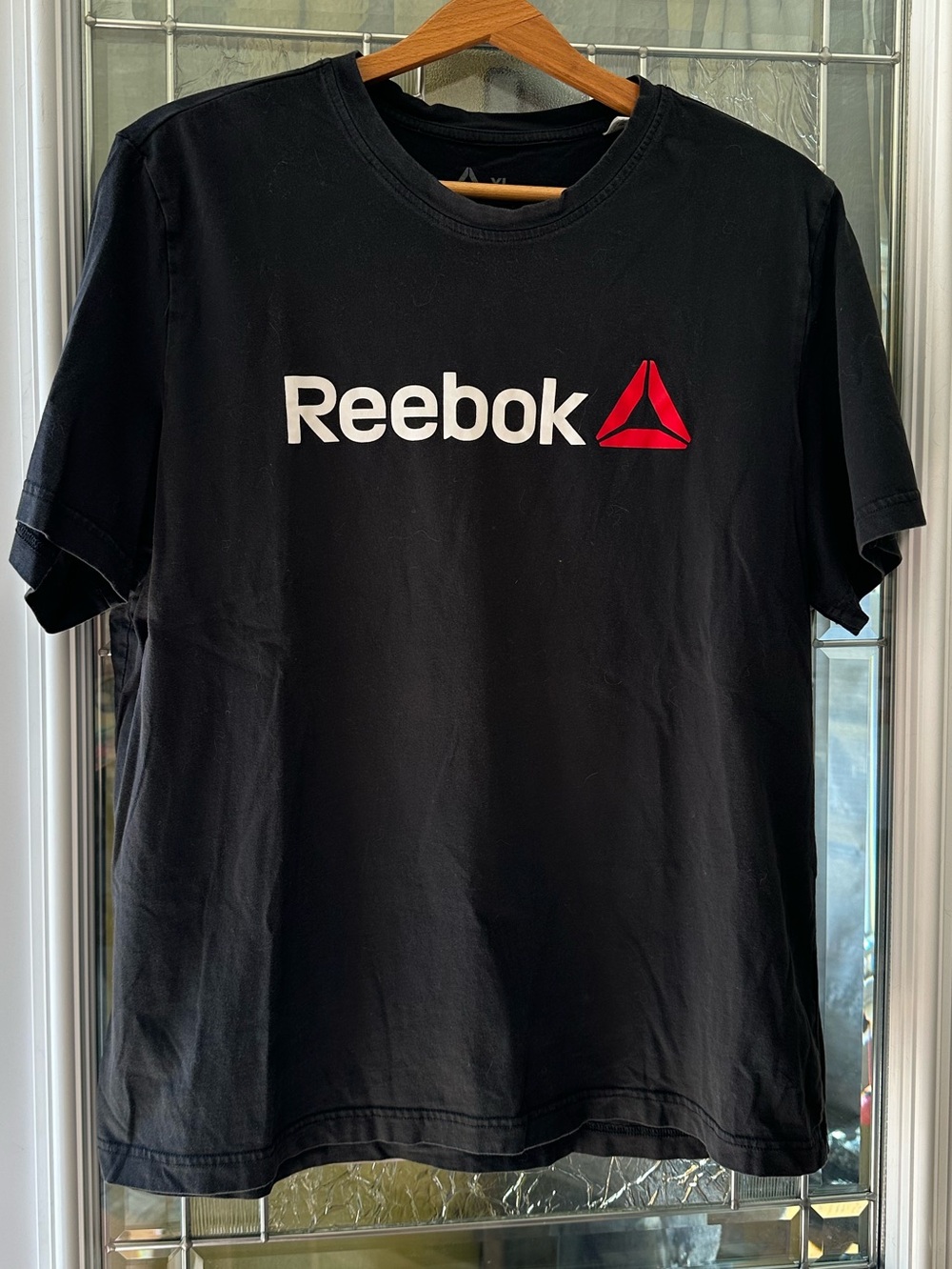 Reebok Black Tee with White Wordmark and Red Delta Logo